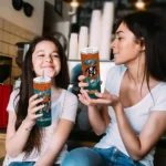 custom-miami-dolphins-kiss-band-orange-skinny-tumbler-best-selling.webp